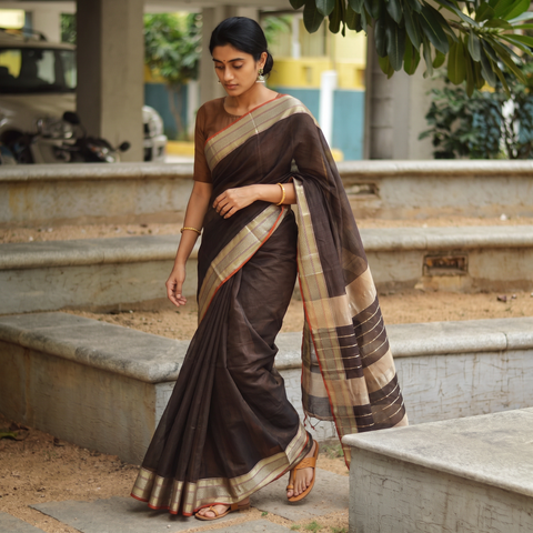 Brown Handloom Silk Cotton Maheshwari Saree with Zari Border, draped and worn by a woman, AI visual of the saree, iTokri