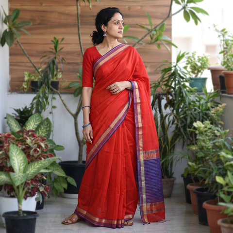 Red Handloom Silk Cotton Maheshwari Saree with Zari Border, draped and worn by a woman, AI visual of the saree, iTokri