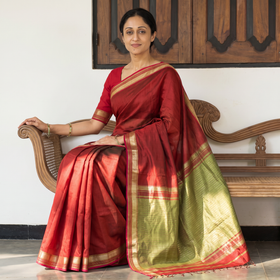 Red Handloom Silk Cotton Maheshwari Saree with Zari Border, draped and worn by a woman, AI visual of the saree, iTokri