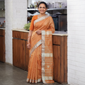 Peach Handloom Tissue Zari Weave Silk Cotton Buti Maheshwari Saree with Zari Border, draped and worn by a woman, AI visual of the saree, iTokri