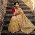 Beige Handloom Tissue Zari Weave Silk Cotton Buti Maheshwari Saree with Zari Border, draped and worn by a woman, AI visual of the saree, iTokri