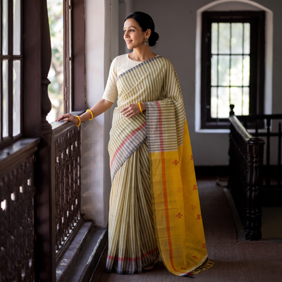 Yellow Handloom Tussar Silk Thread Buti Stripes Saree, draped and worn by a woman, AI visual of the saree, iTokri