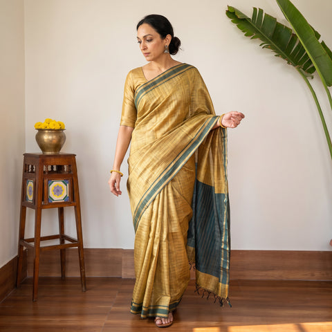Yellow Handloom Tussar Silk Zari Border Bhagalpuri Saree, draped and worn by a woman, AI visual of the saree, iTokri