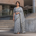 Grey Handloom Zari Border Maheshwari Silk Saree, draped and worn by a woman, AI visual of the saree, iTokri