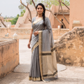 Grey Handloom Zari Border Maheshwari Silk Saree, draped and worn by a woman, AI visual of the saree, iTokri