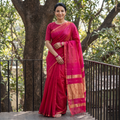 Pink Handloom Zari Buti Maheshwari Silk Saree, draped and worn by a woman, AI visual of the saree, iTokri