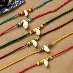 Handmade jute fabart shell work rakhi (set of 6) 155