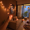 Lily Bougainvillea Handmade Crochet LED String Light for Home Decor, lit in a home in the evening, AI visual of the light, iTokri