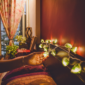Lily Bougainvillea Handmade Crochet LED String Light for Home Decor, lit in a home in the evening, AI visual of the light, iTokri