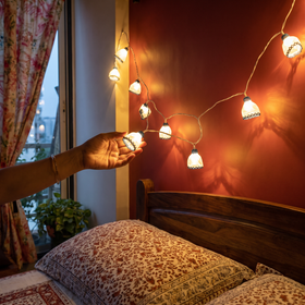 Frock Handmade Crochet LED String Light for Home Decor, lit in a home in the evening, AI visual of the light, iTokri