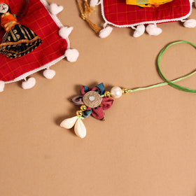Buy Handmade Fabric Flower Jute Rakhi & Lumba Set 