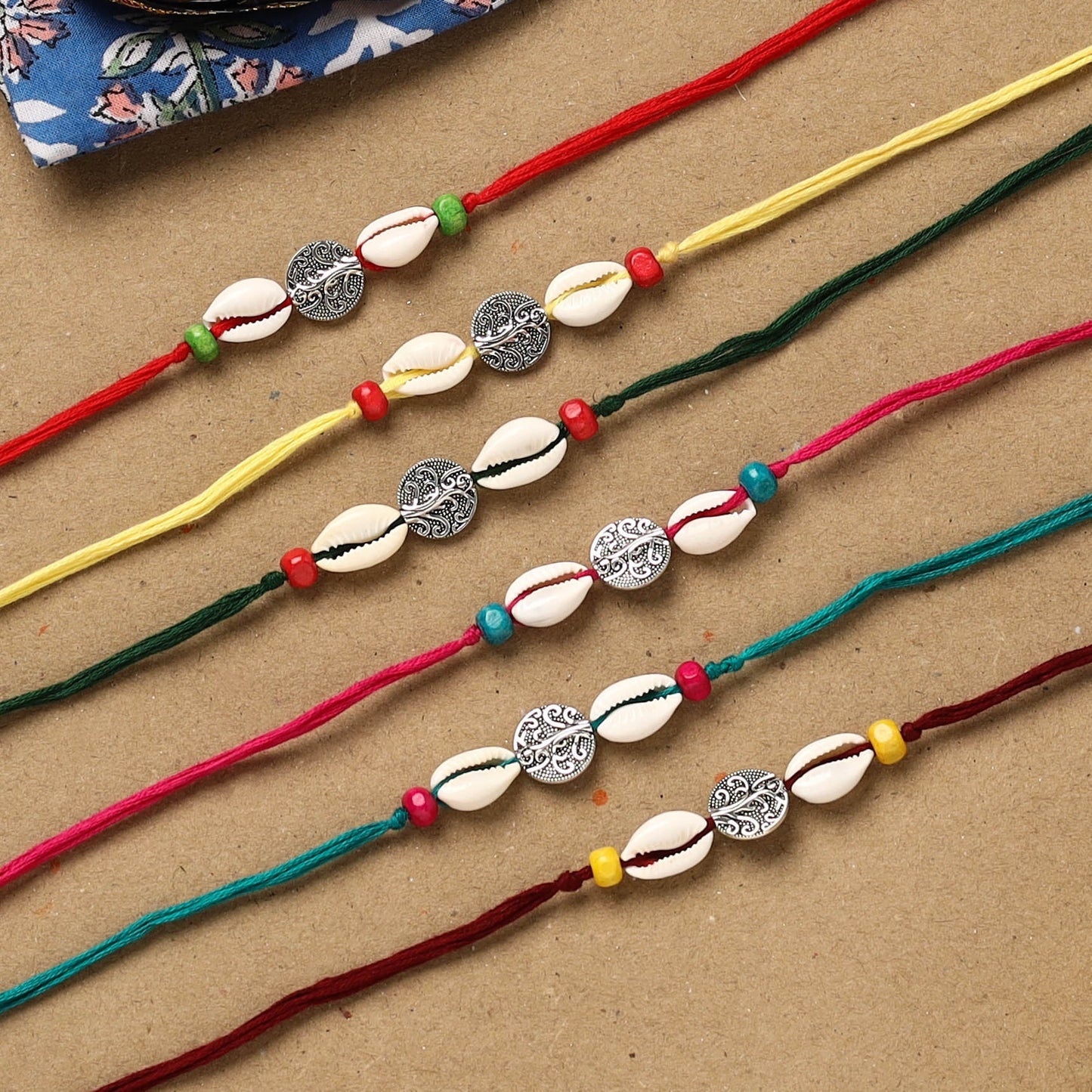 Handmade jute fabart shell work rakhi (set of 6) 157