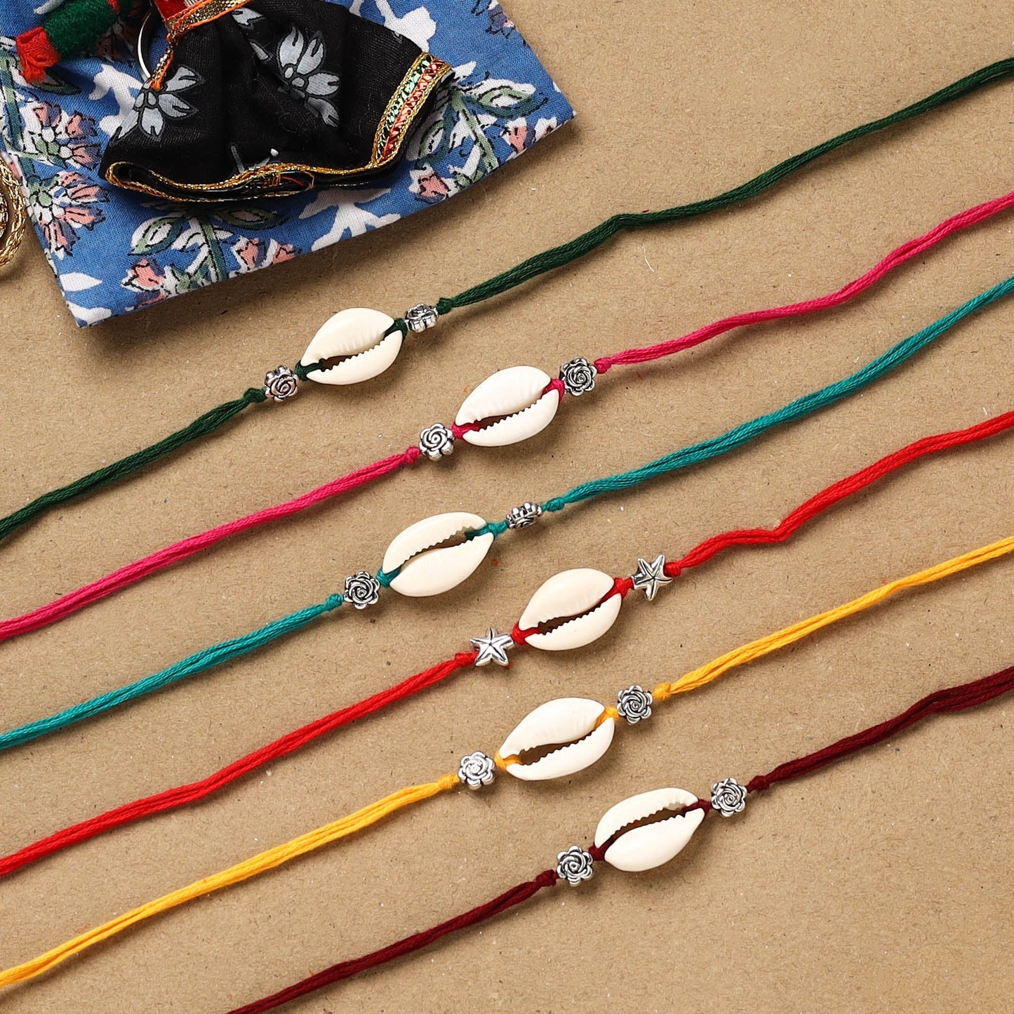 Handmade jute fabart shell work rakhi (set of 6) 159