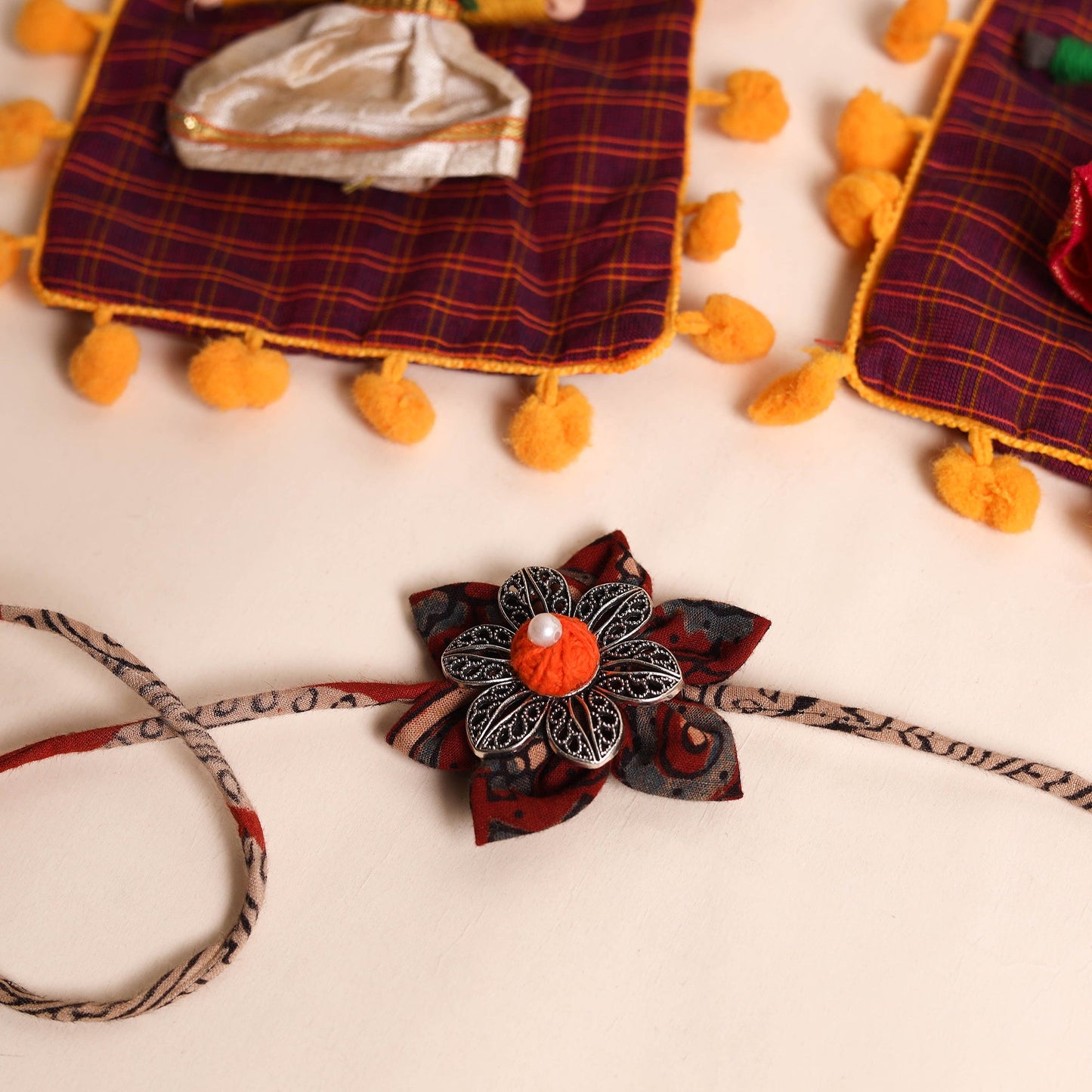  Handmade GS Fabric Flower Rakhi (Set of 2)