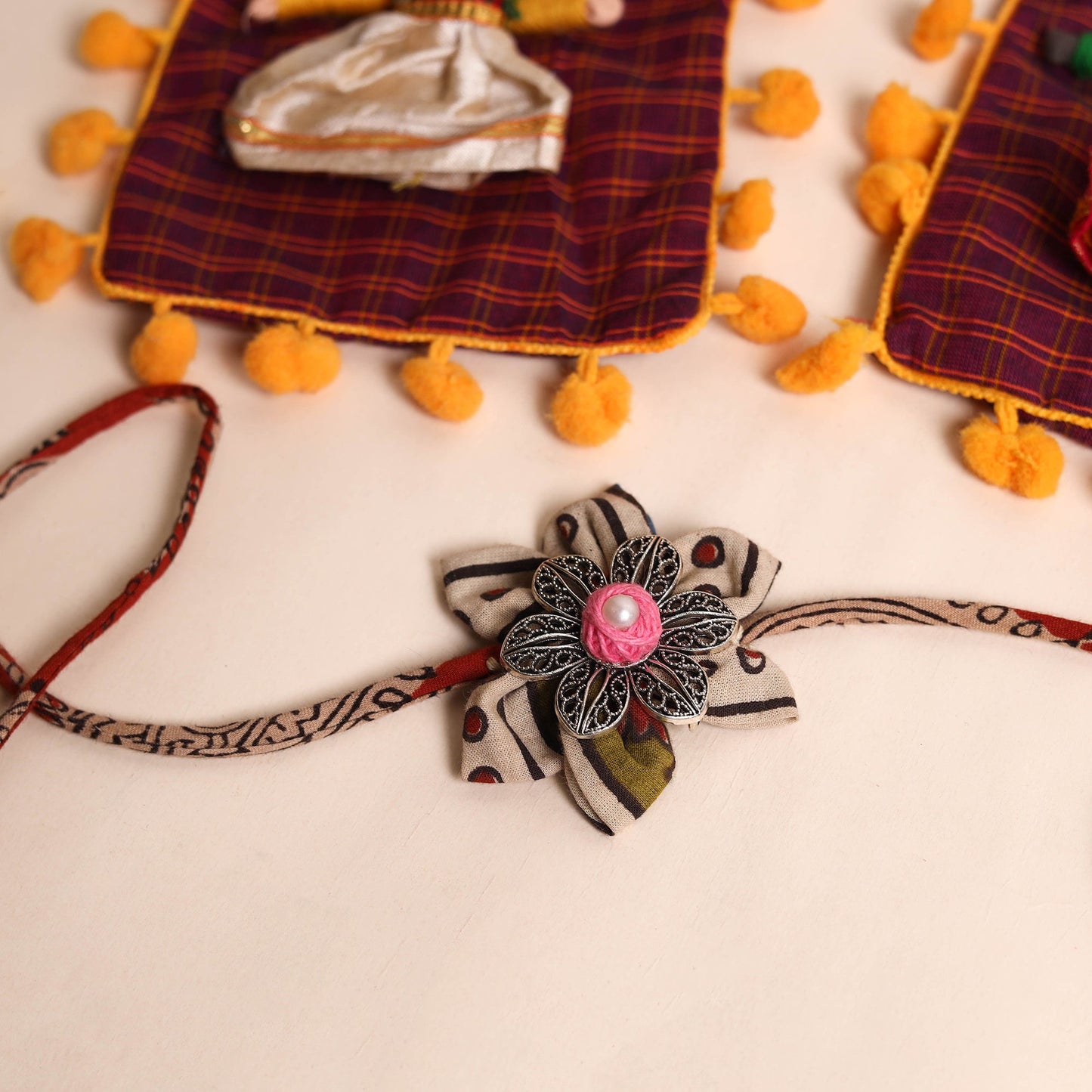  Handmade GS Fabric Flower Rakhi (Set of 2)