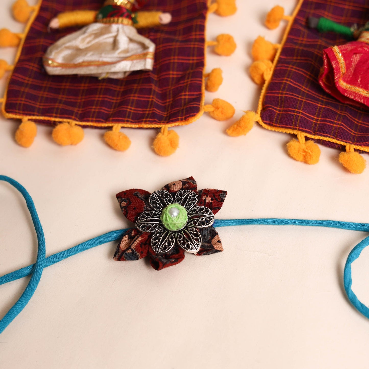  Handmade GS Fabric Flower Rakhi (Set of 2)