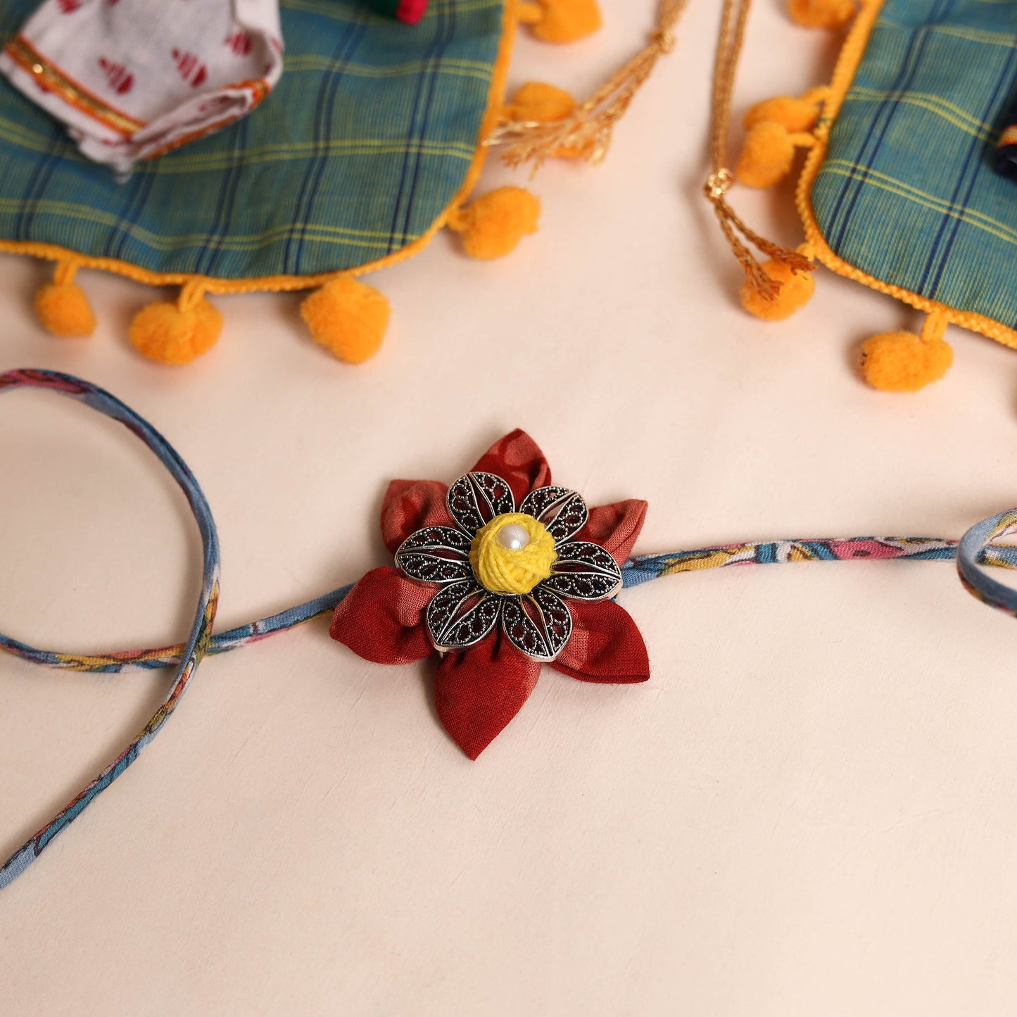  Handmade GS Fabric Flower Rakhi (Set of 2)
