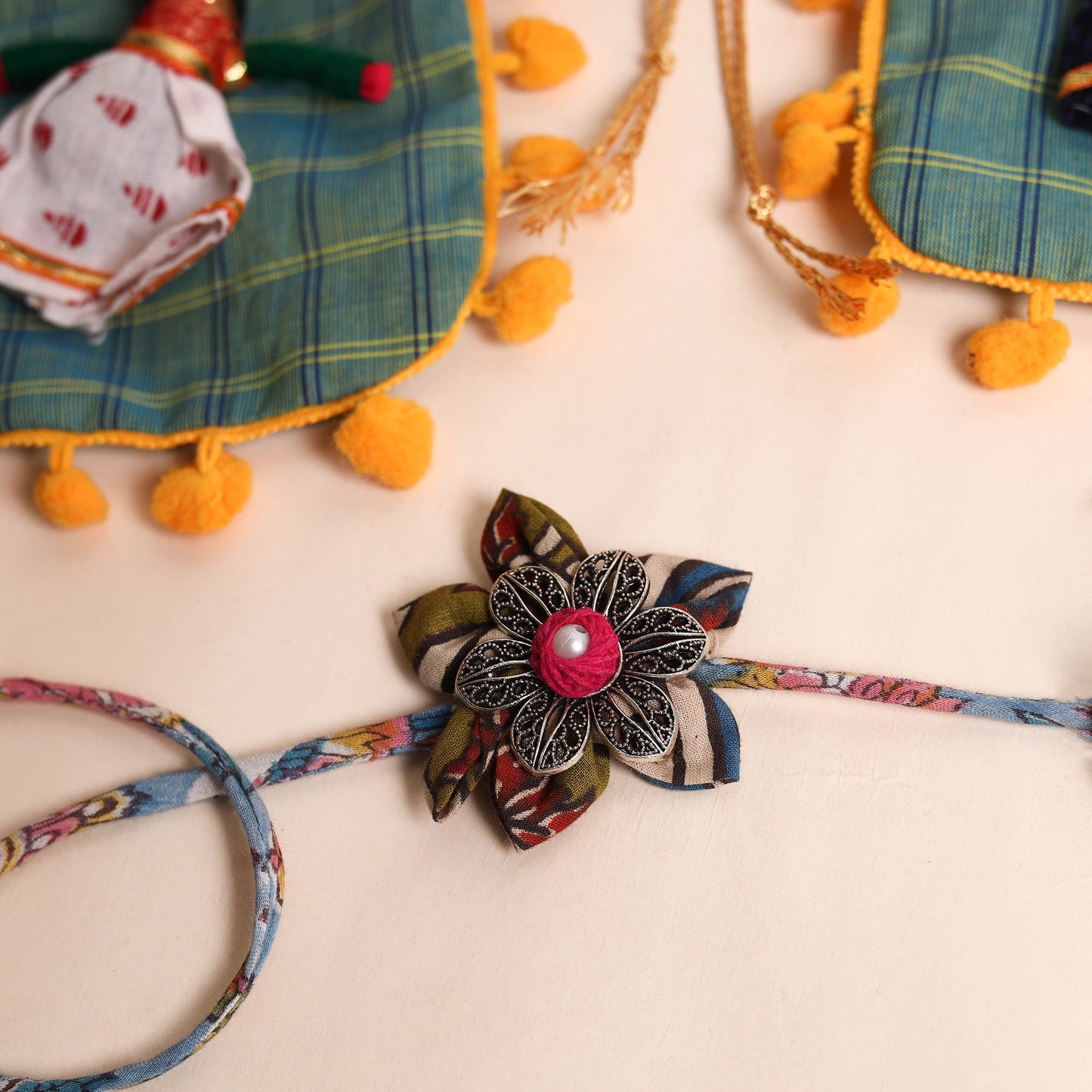  Handmade GS Fabric Flower Rakhi (Set of 2)