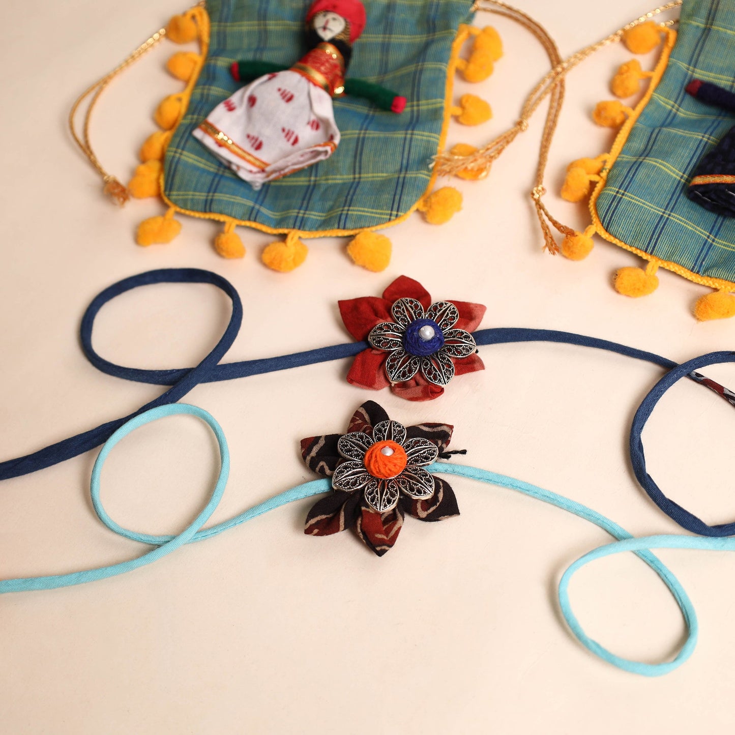  Handmade GS Fabric Flower Rakhi (Set of 2)