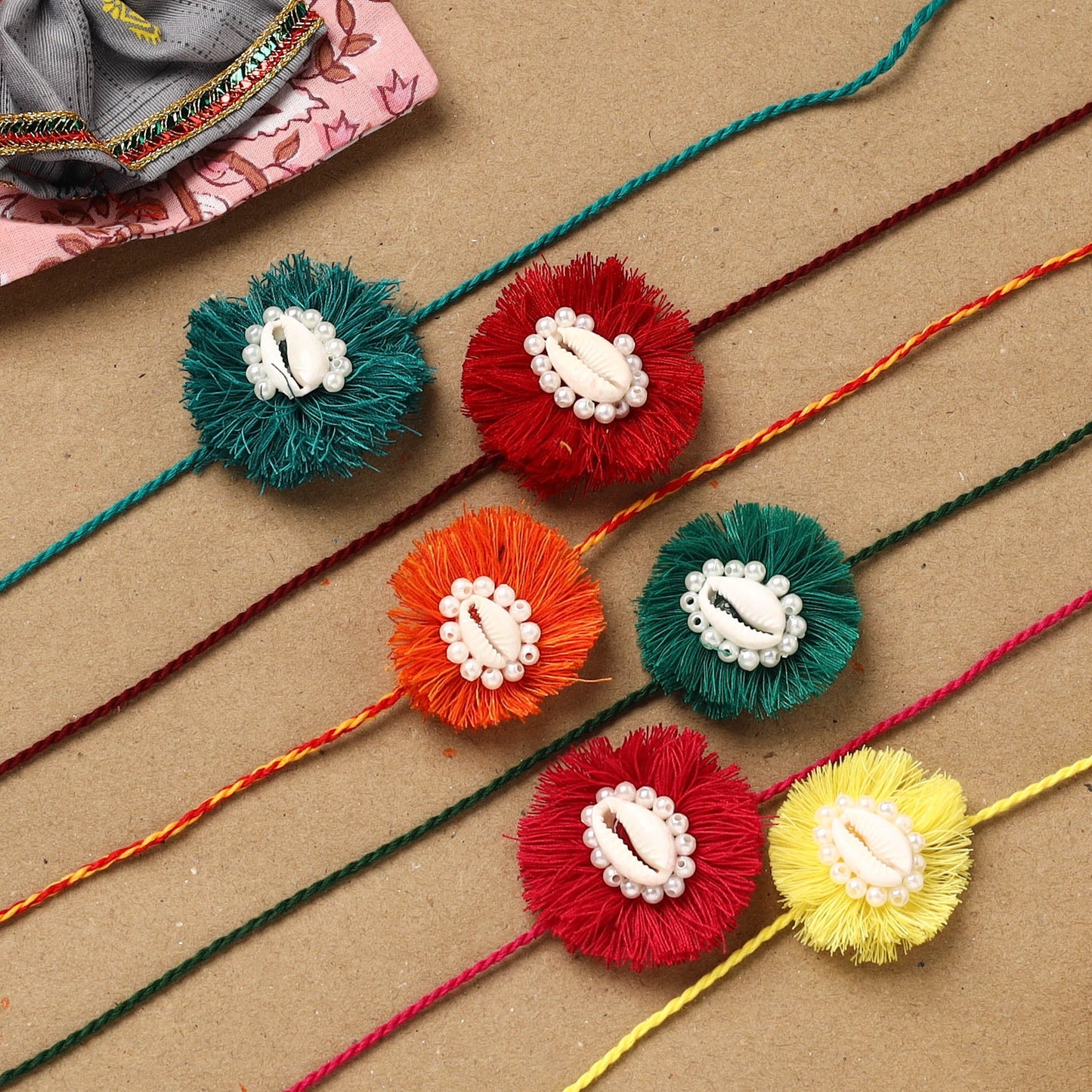 Handmade jute fabart shell work rakhi (set of 6) 154