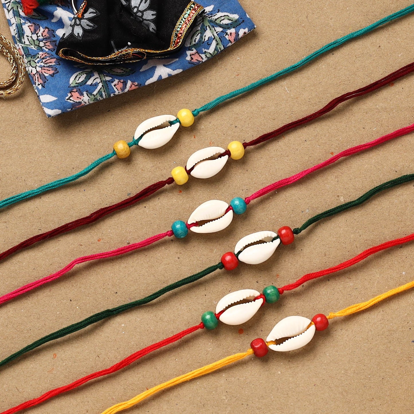 Handmade jute fabart shell work rakhi (set of 6) 158