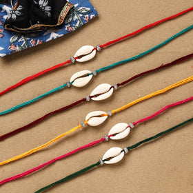 Handmade jute fabart shell work rakhi (set of 6) 160