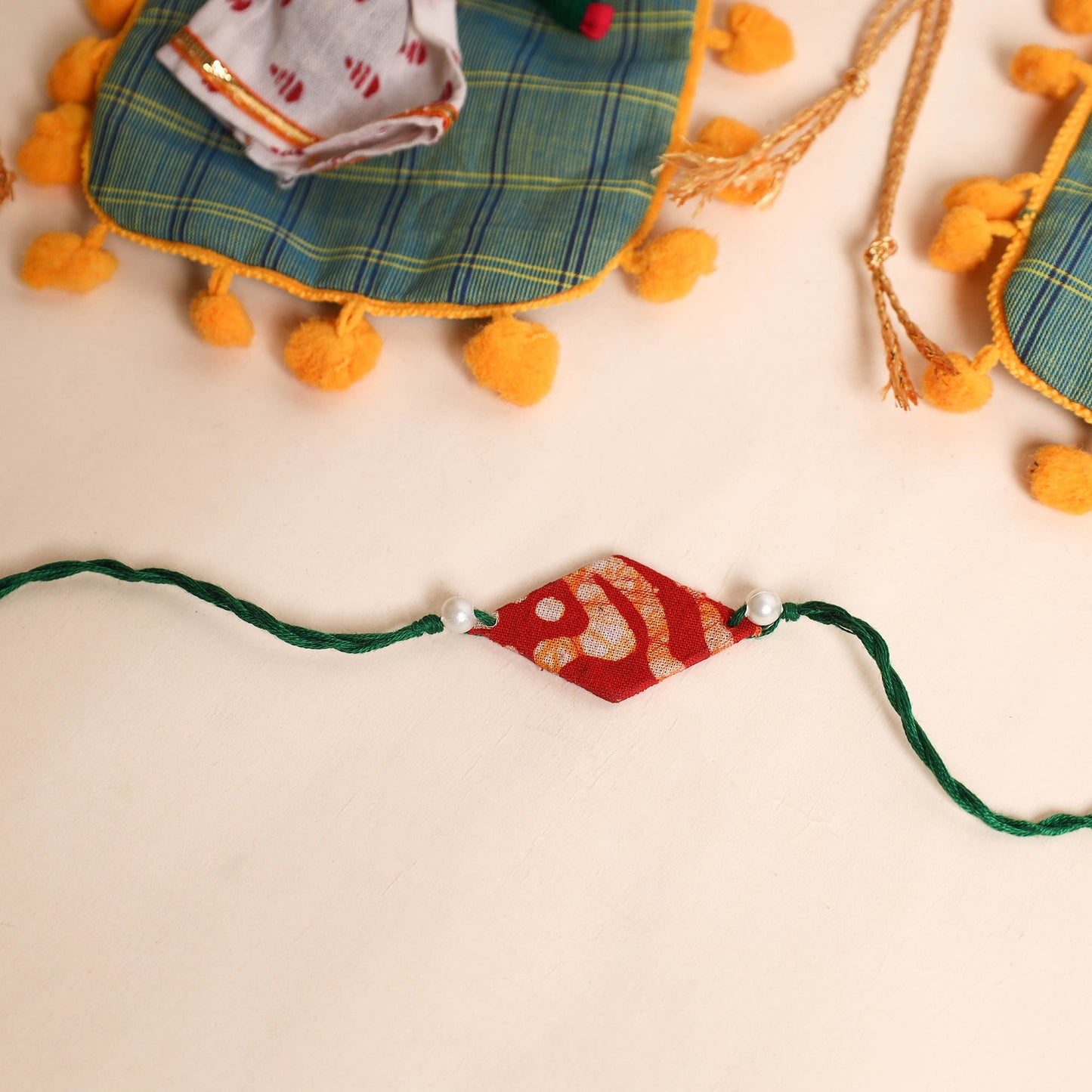  Handmade Pearl Fabric Rakhi (Set of 2)