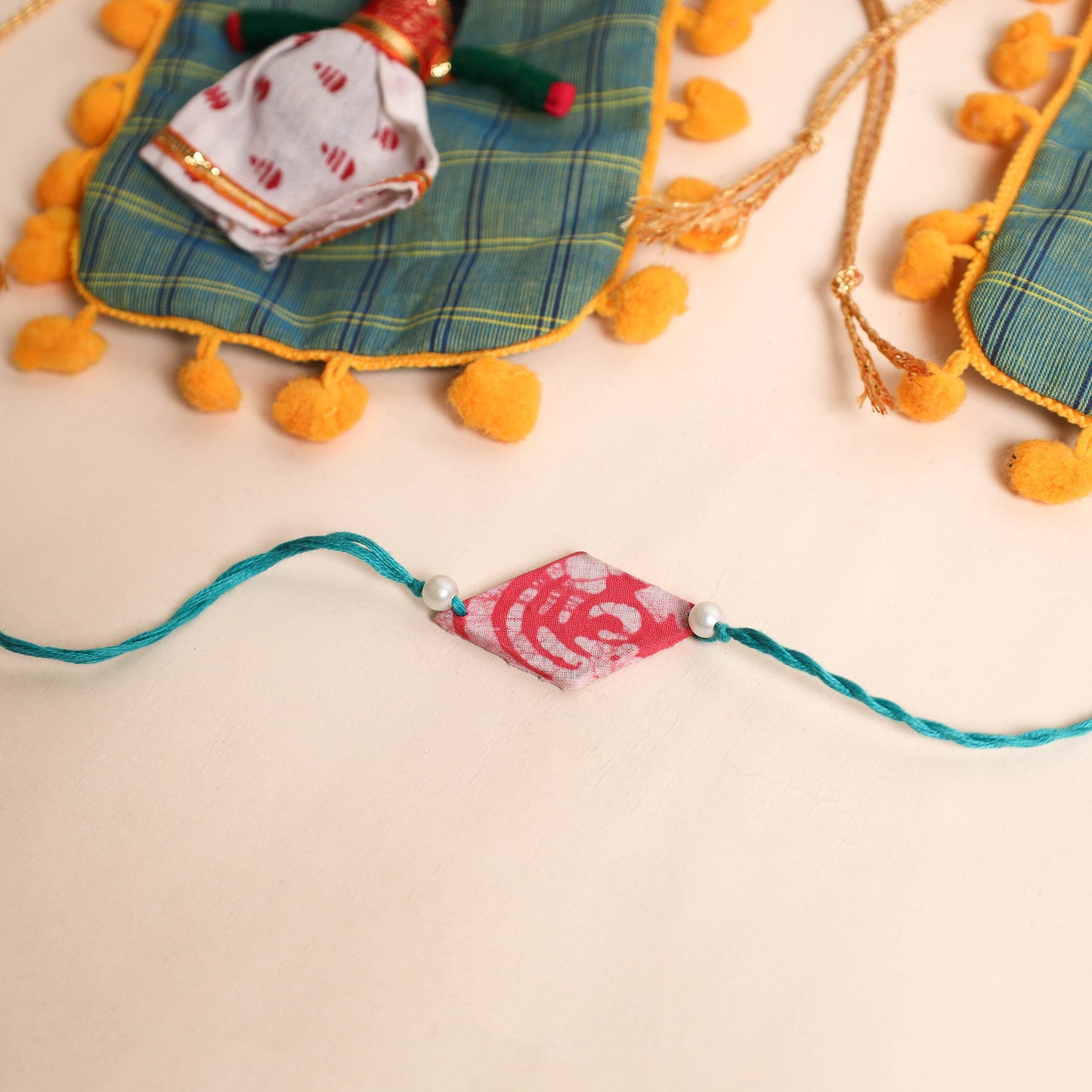  Handmade Pearl Fabric Rakhi (Set of 2)