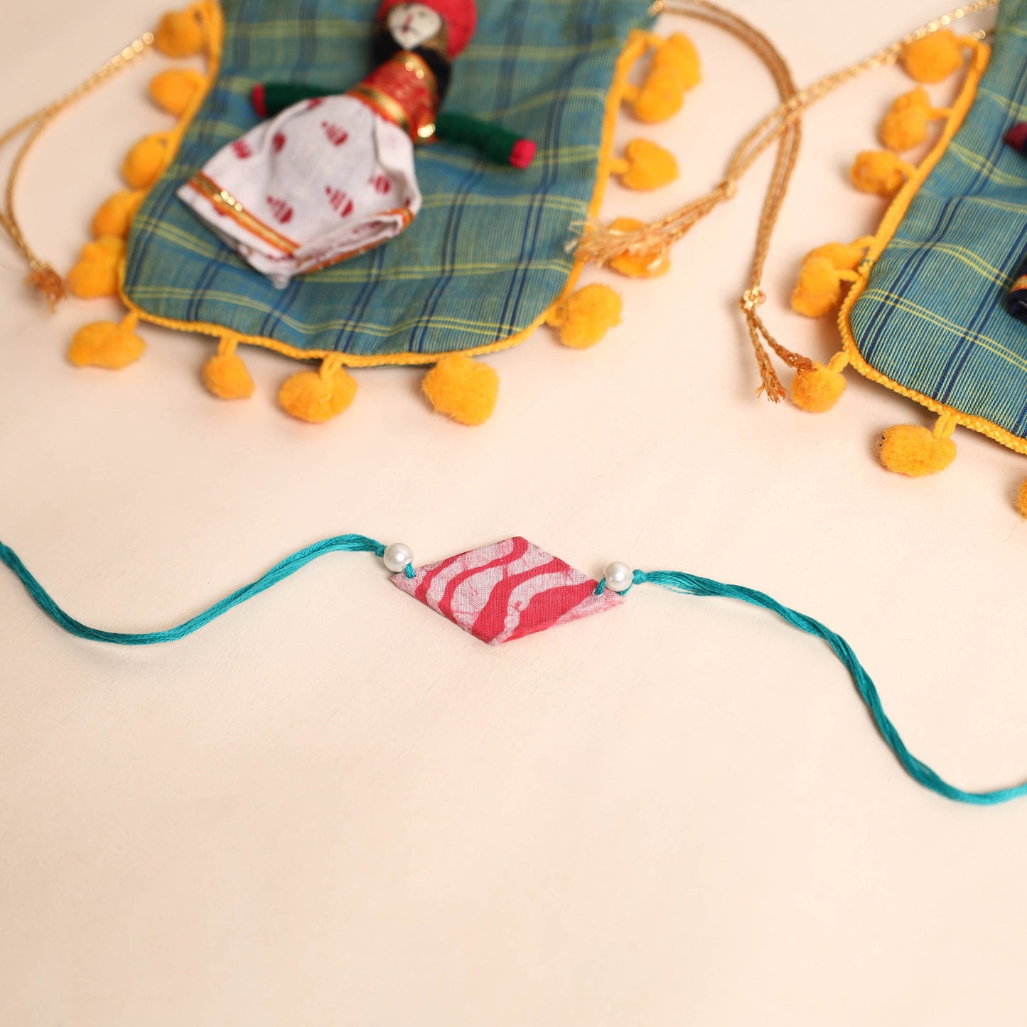  Handmade Pearl Fabric Rakhi (Set of 2)