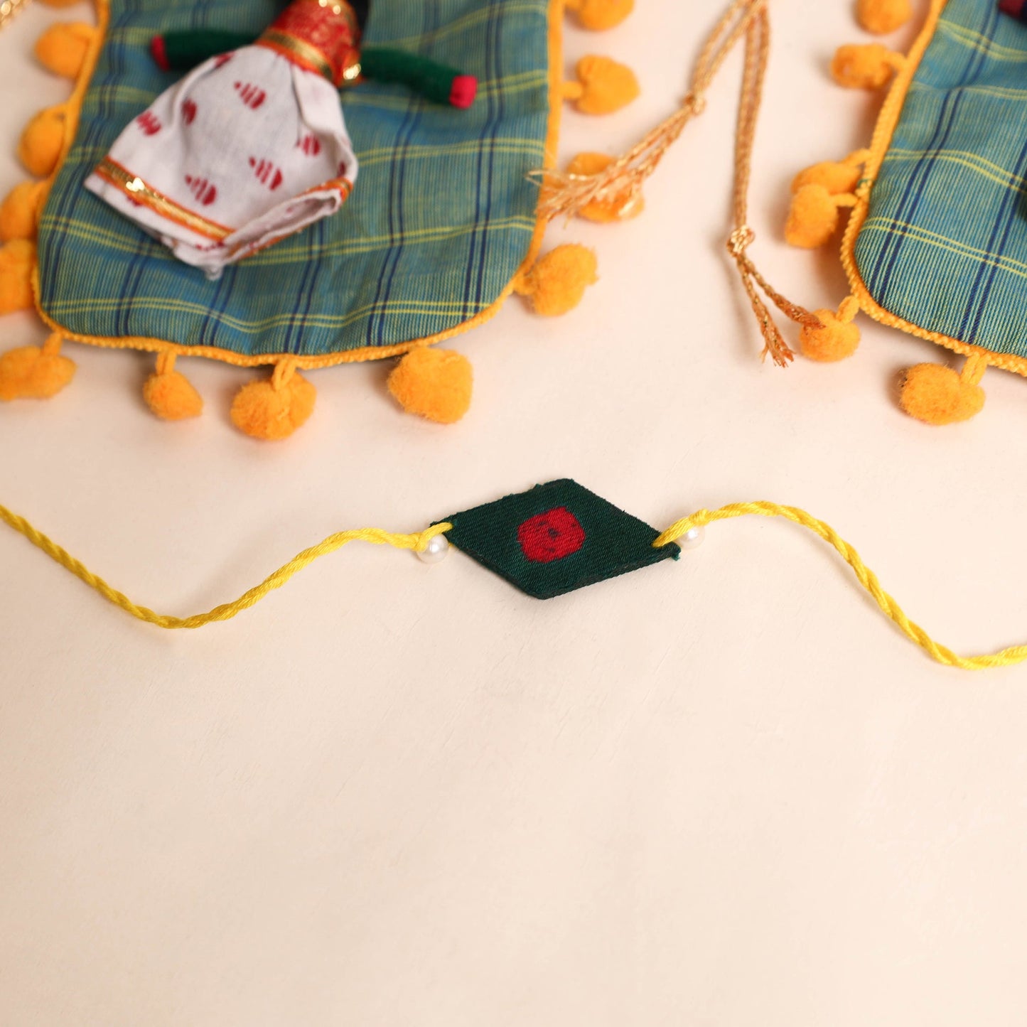  Handmade Pearl Fabric Rakhi (Set of 2)