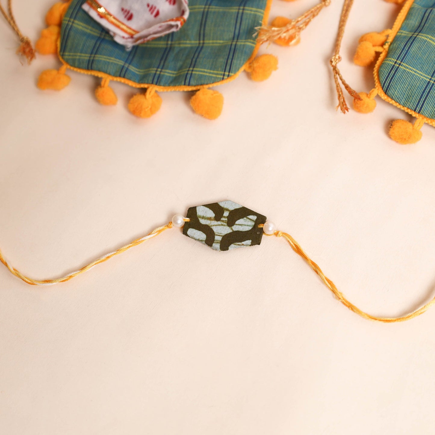  Handmade Pearl Fabric Rakhi (Set of 2)