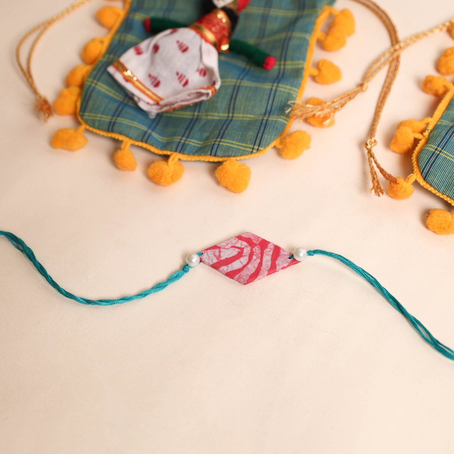  Handmade Pearl Fabric Rakhi (Set of 2)