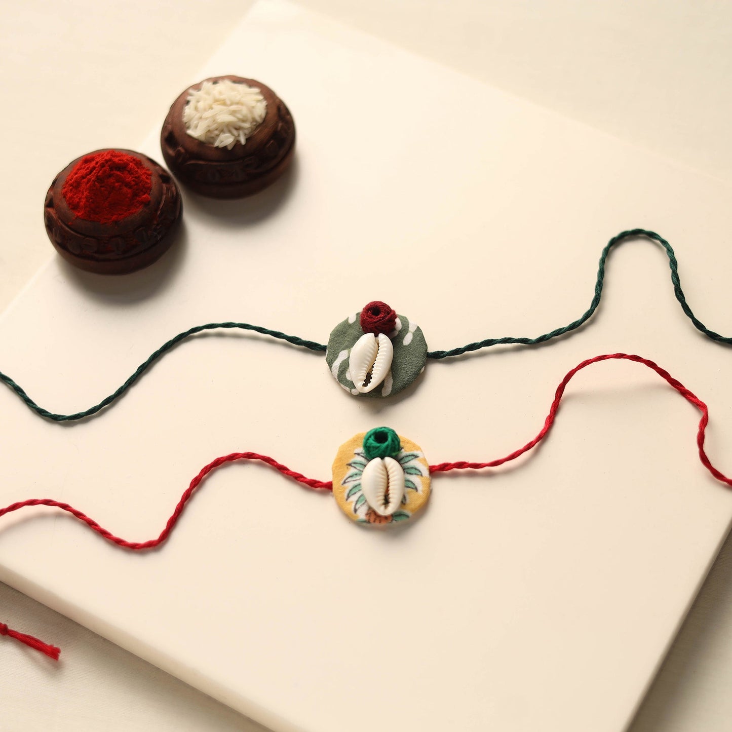 Handmade Shell Work Fabart Rakhi (Set of 2)