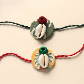 Handmade Shell Work Fabart Rakhi (Set of 2)