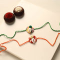 Handmade Shell Work Fabart Rakhi (Set of 2)