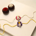 Handmade Shell Work Fabart Rakhi (Set of 2)