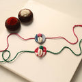 Handmade Shell Work Fabart Rakhi (Set of 2)
