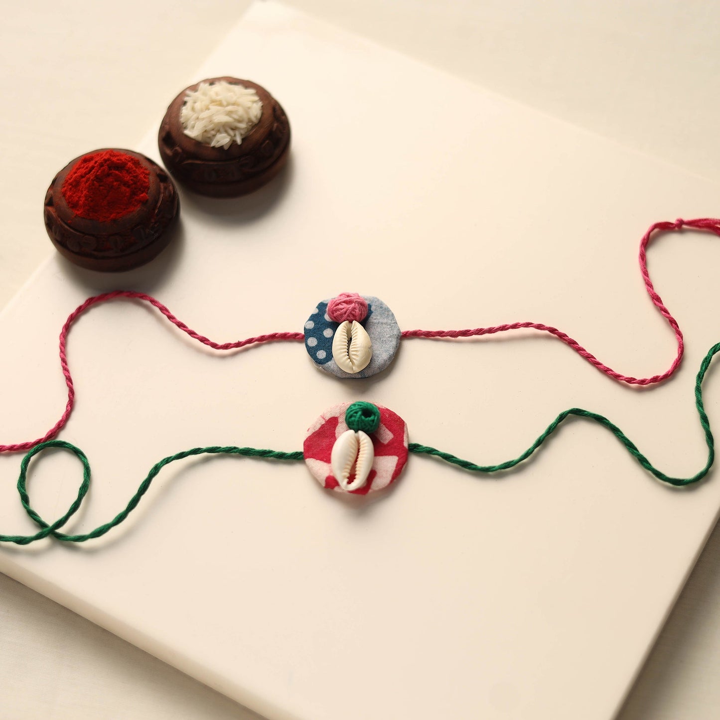 Handmade Shell Work Fabart Rakhi (Set of 2)