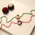 Handmade Shell Work Fabart Rakhi (Set of 2)