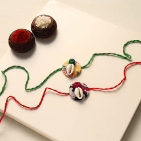 Handmade Shell Work Fabart Rakhi (Set of 2)