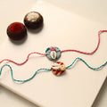 Handmade Shell Work Fabart Rakhi (Set of 2)