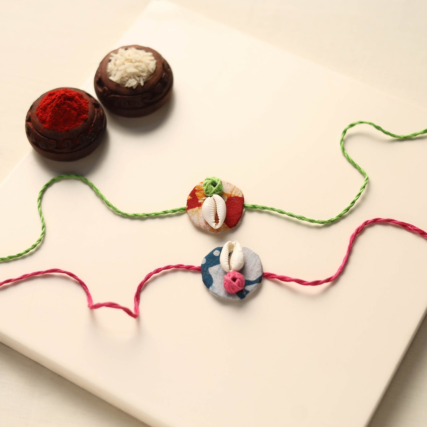 Handmade Shell Work Fabart Rakhi (Set of 2)