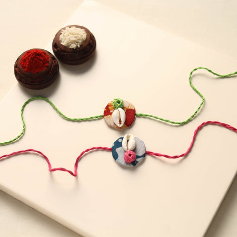 Handmade Shell Work Fabart Rakhi (Set of 2)