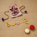 Handmade shell work rakhi 144 - handcrafted