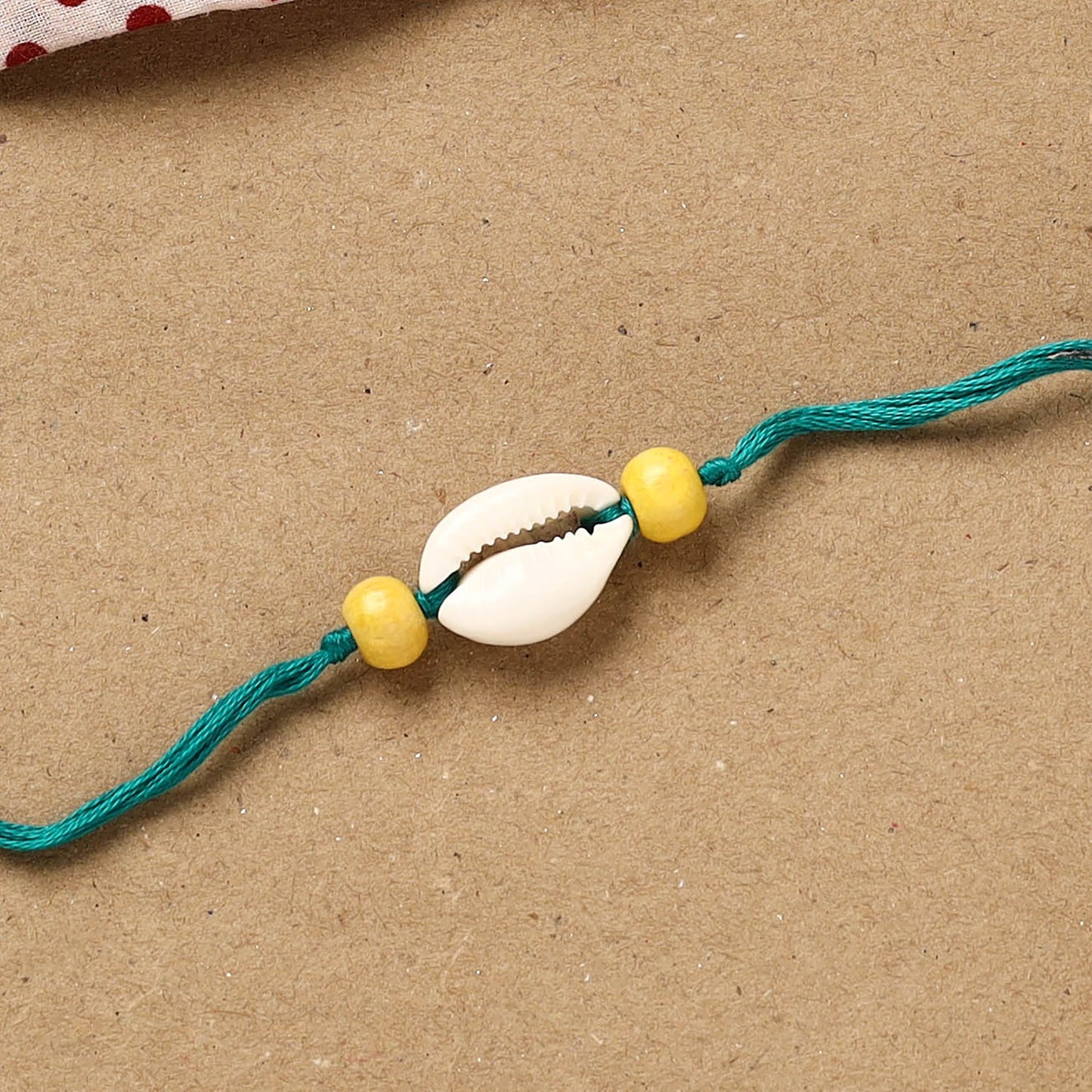 Handmade shell work rakhi 150 - handcrafted