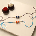 Handmade Thread & Bead Work Rakhi (Set of 2)