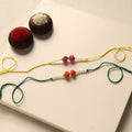 Handmade Thread & Bead Work Rakhi (Set of 2)