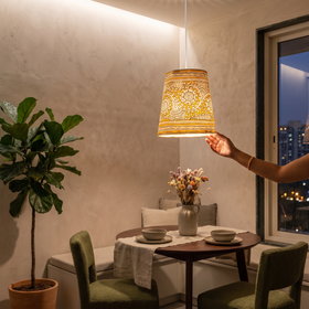 Handpainted Tholu Bommalata Leather Hanging Lamp, lit in a home in the evening, AI visual of the light, iTokri