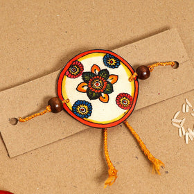  Handpainted Tholu Bommalata Leather Rakhi 