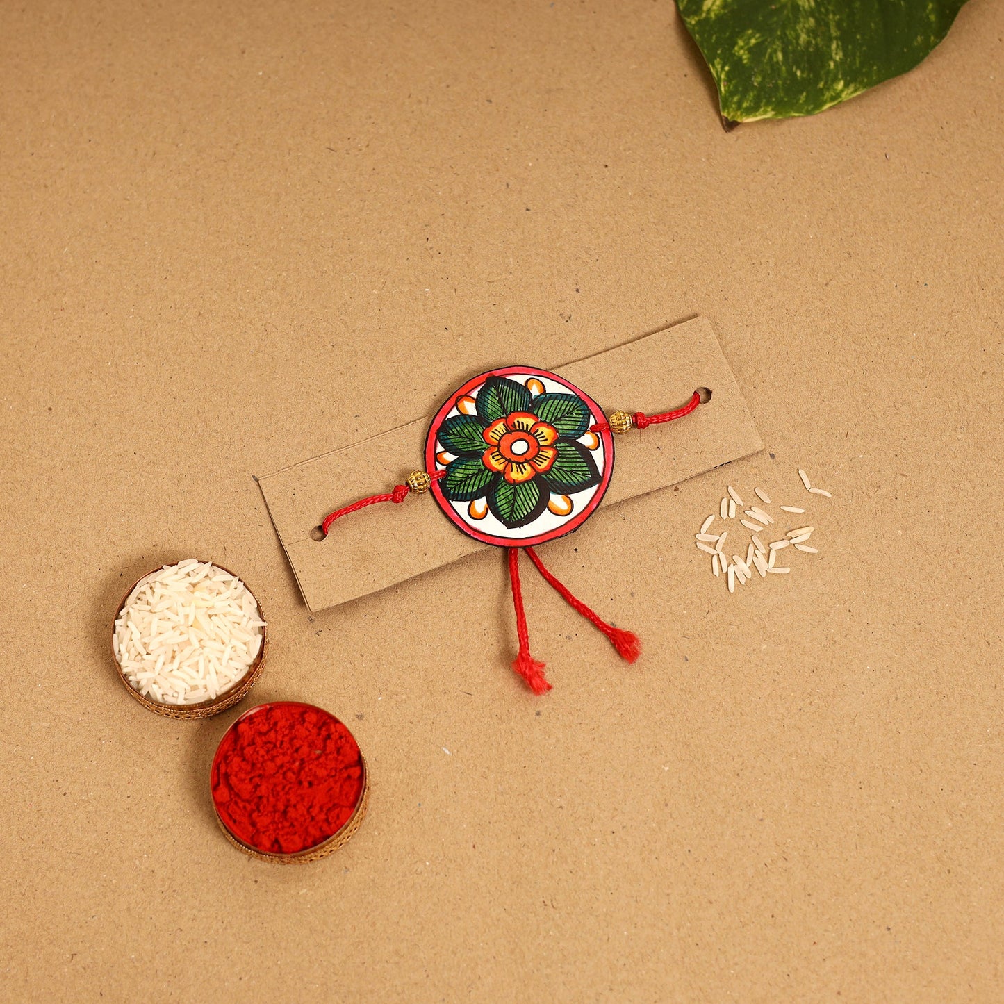  Handpainted Tholu Bommalata Leather Rakhi 